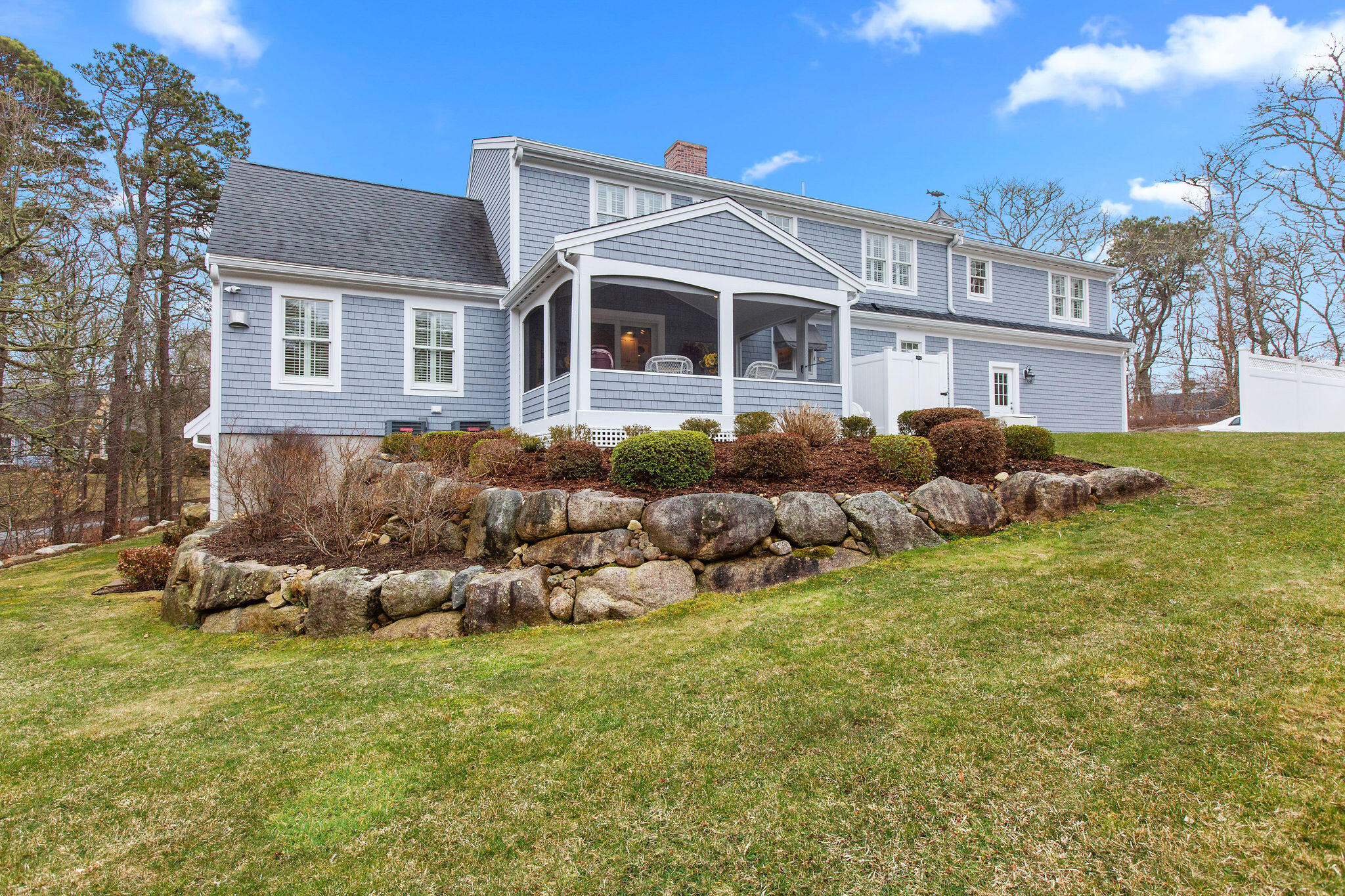 154 Beechtree Drive Brewster, MA 02631 - Photo 16 of 76 a front view of house with yard and trees around