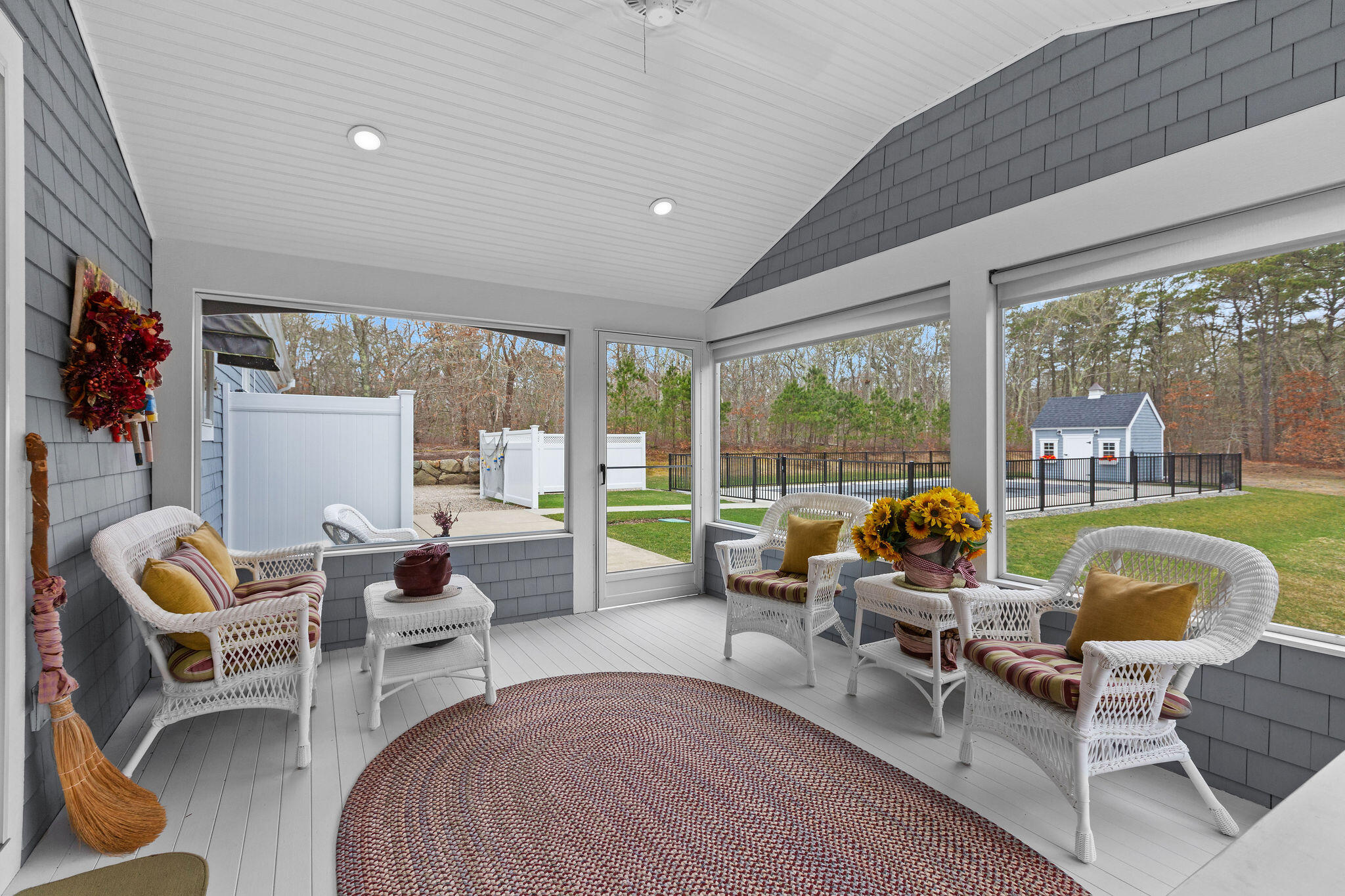 154 Beechtree Drive Brewster, MA 02631 - Photo 22 of 76 a living room with furniture a rug potted plant and a large window