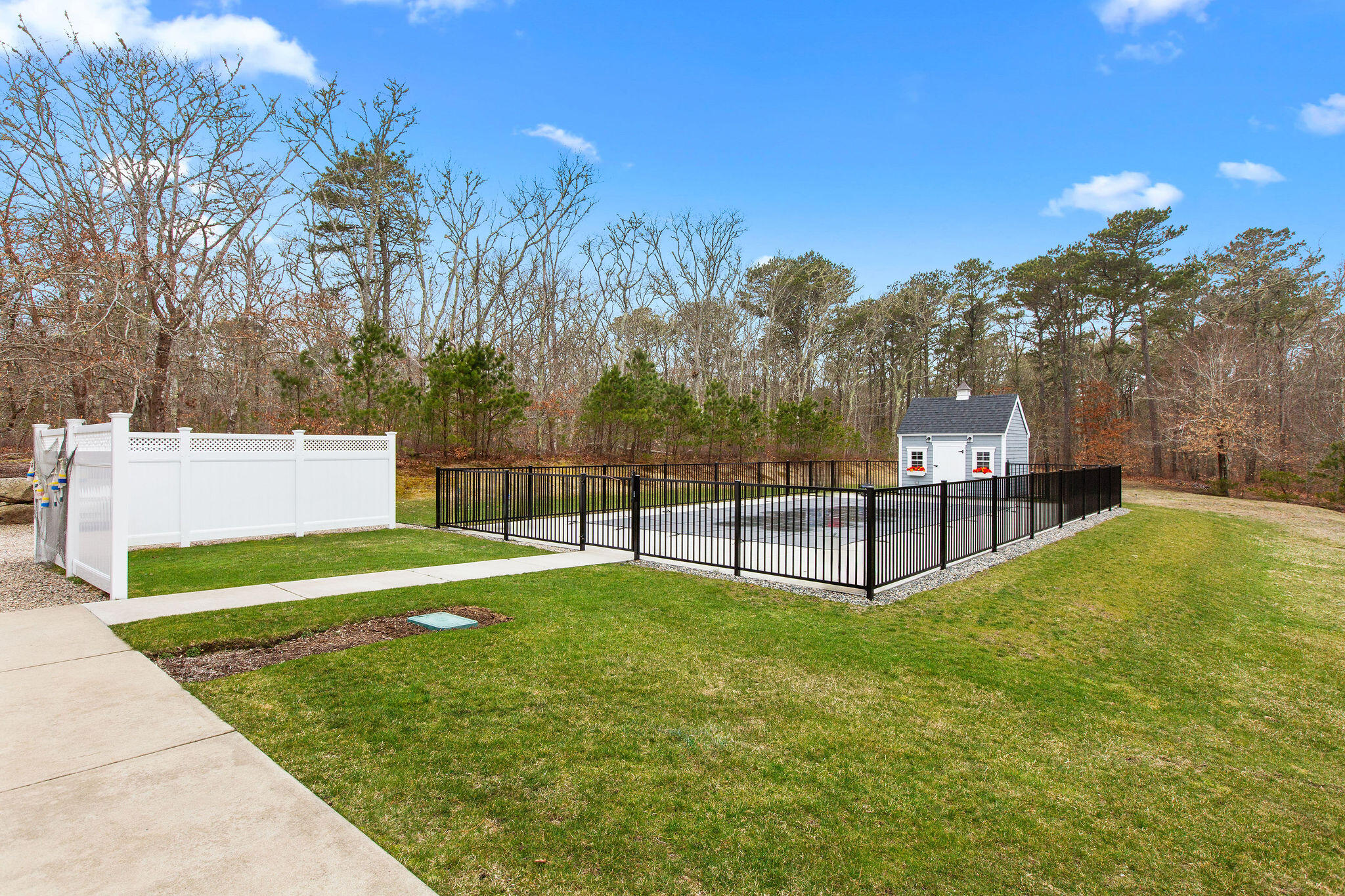 154 Beechtree Drive Brewster, MA 02631 - Photo 23 of 76 a view of backyard with swimming pool and trees