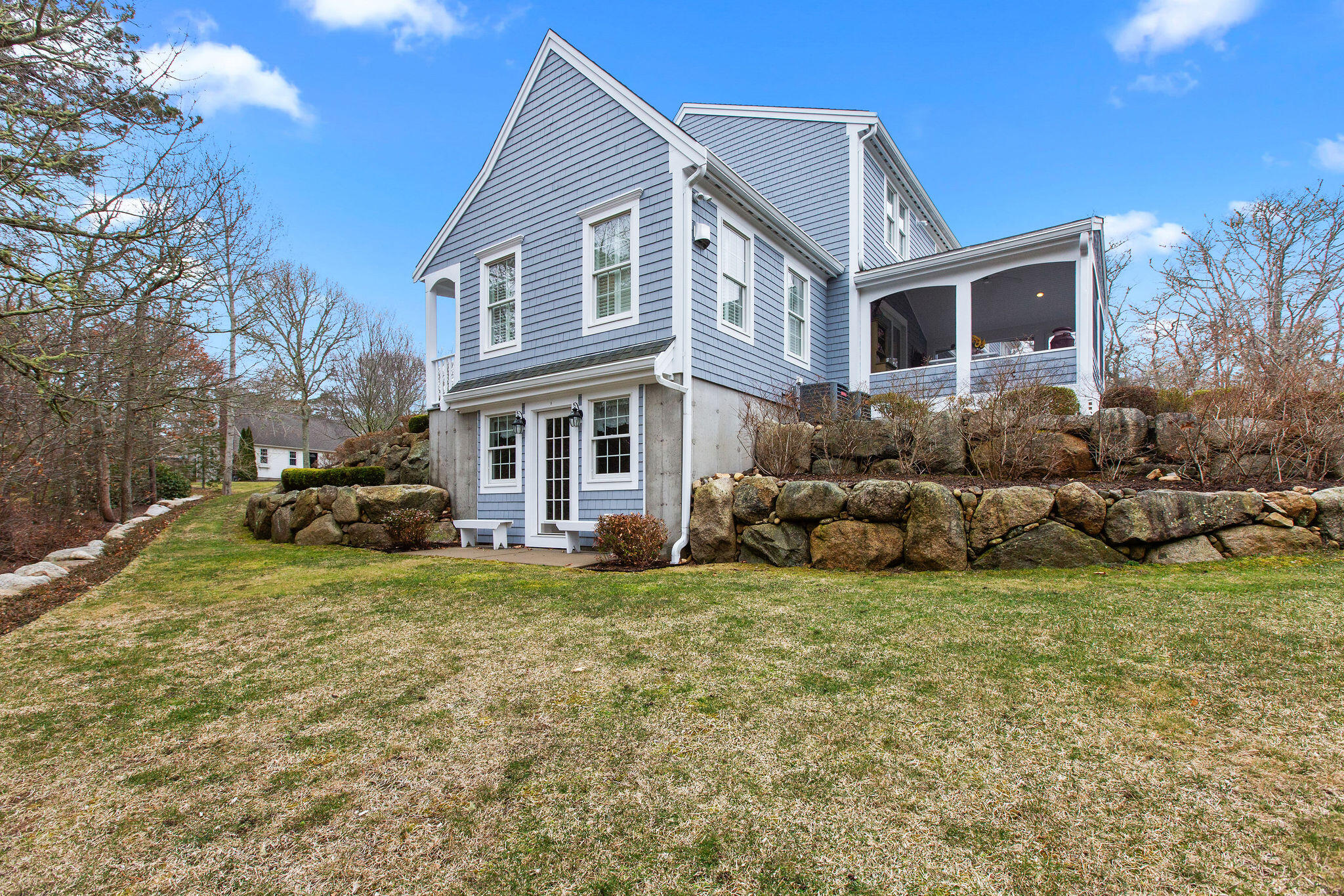 154 Beechtree Drive Brewster, MA 02631 - Photo 25 of 76 a view of a house with a yard