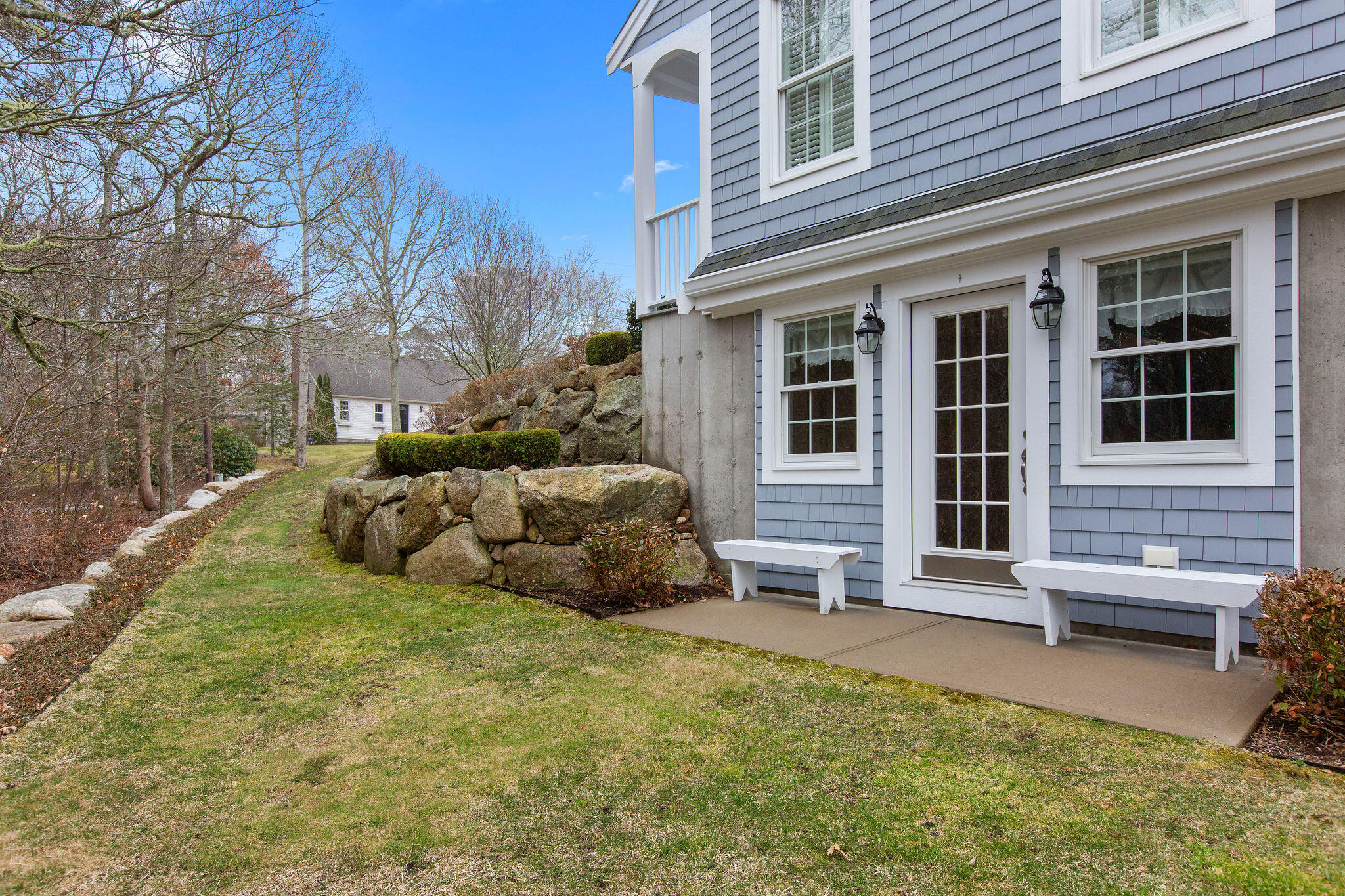 154 Beechtree Drive Brewster, MA 02631 - Photo 26 of 76 a view of a house with a yard and couches chairs