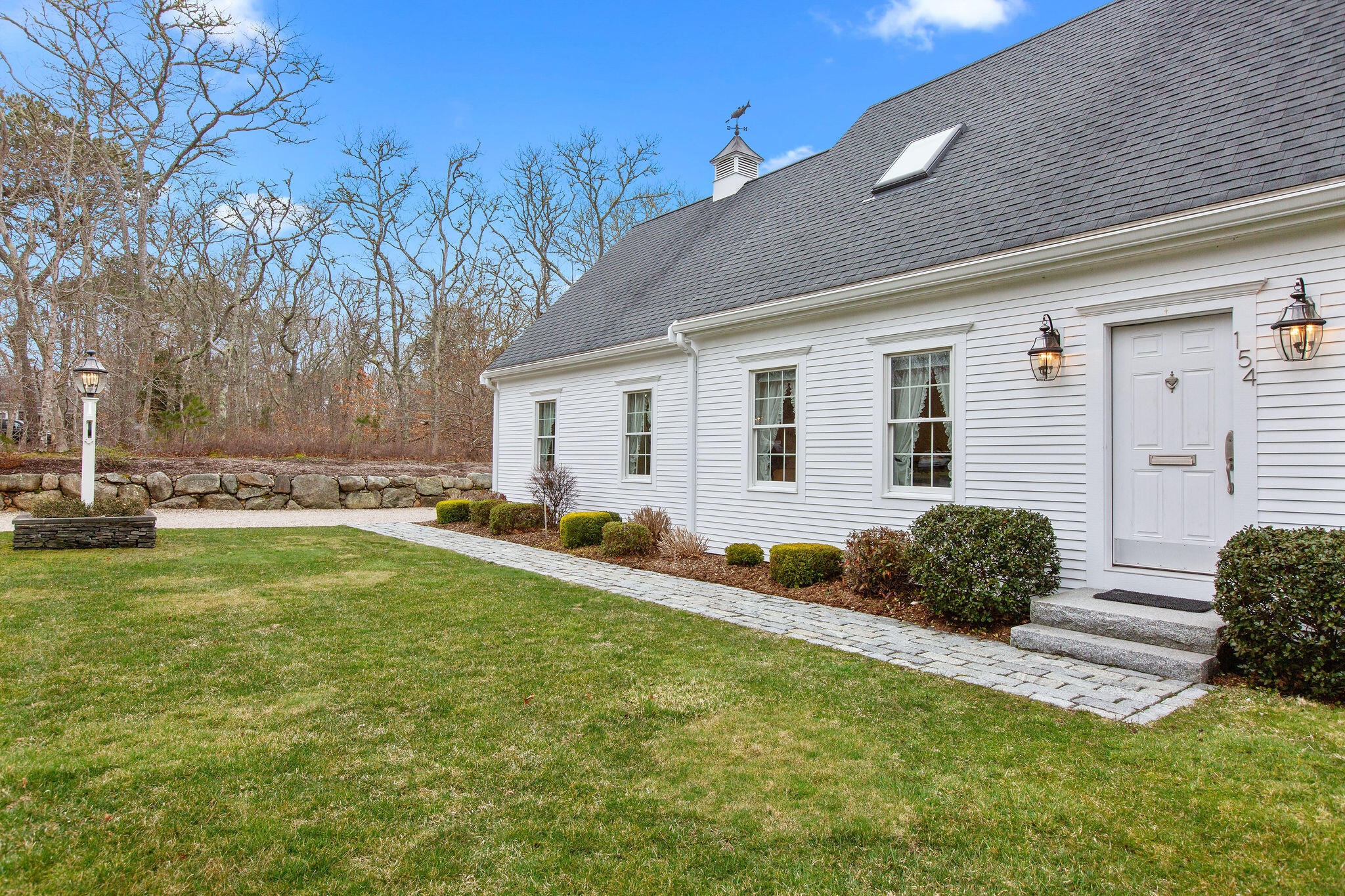 154 Beechtree Drive Brewster, MA 02631 - Photo 3 of 76 a backyard of a house with table and chairs