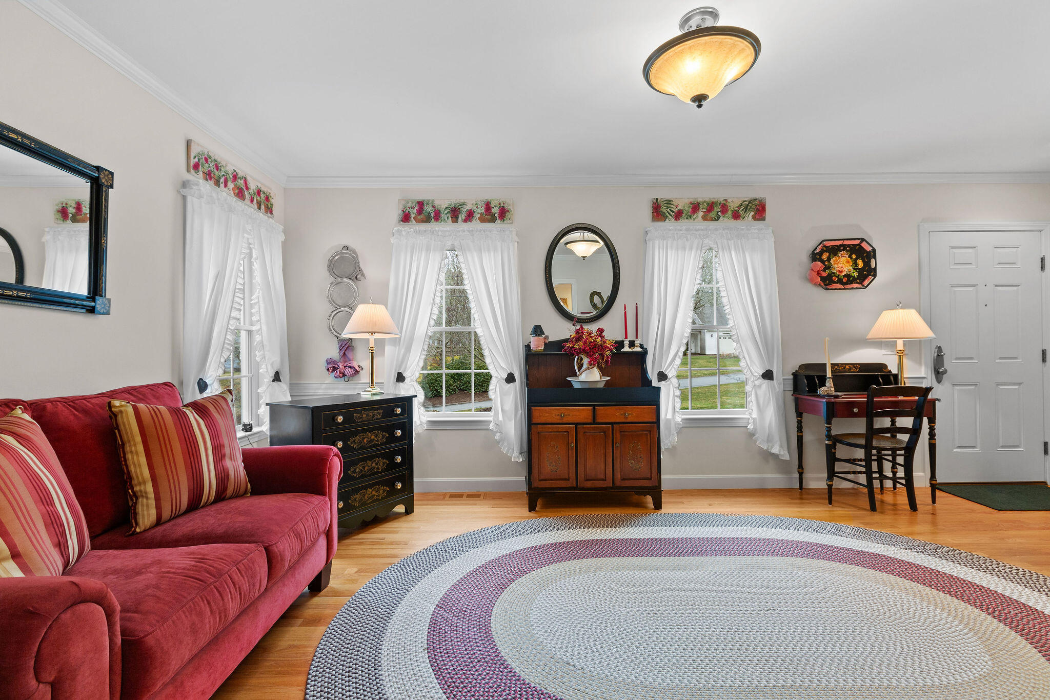 154 Beechtree Drive Brewster, MA 02631 - Photo 31 of 76 a living room with furniture and a wooden floor
