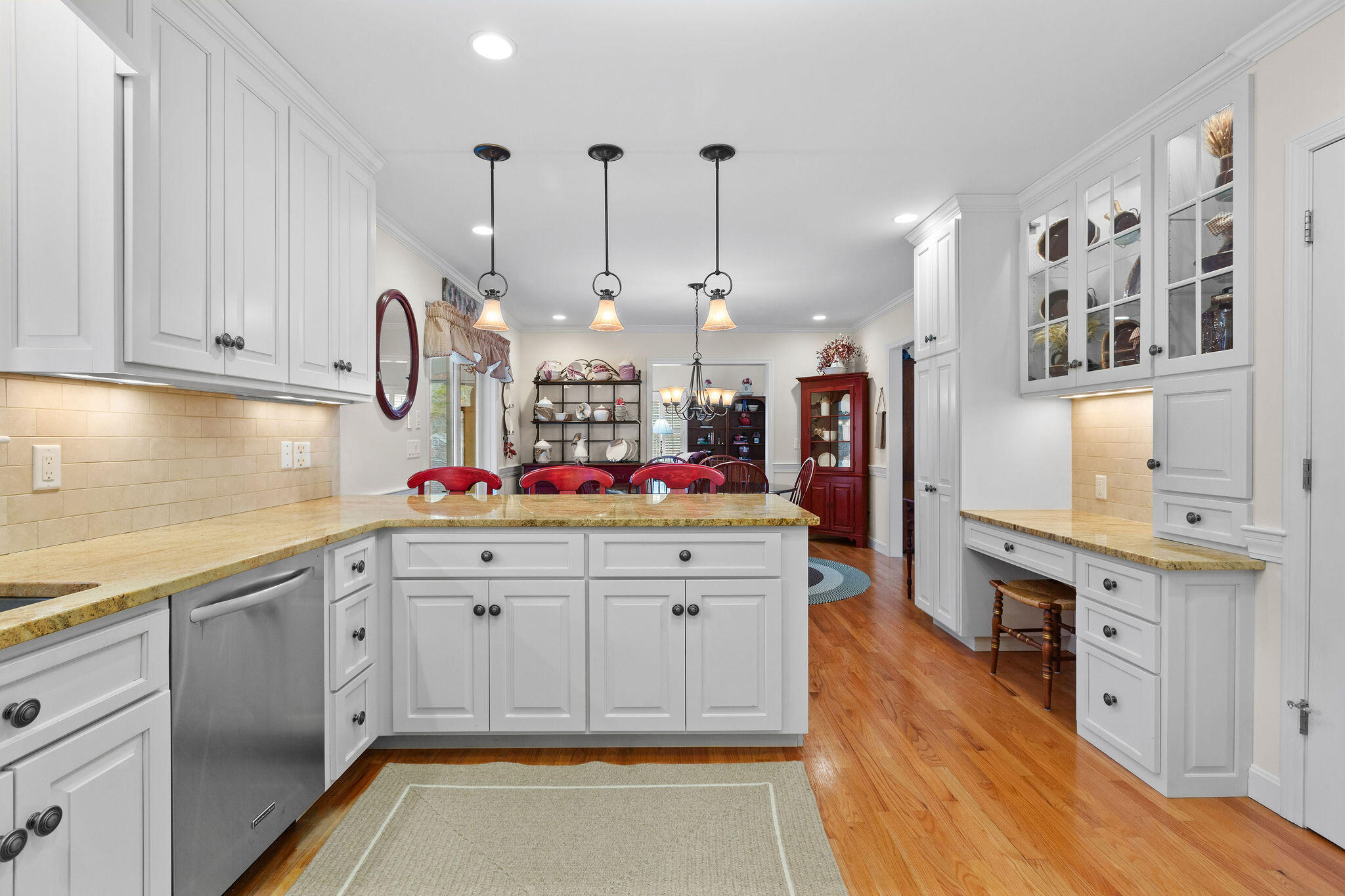 154 Beechtree Drive Brewster, MA 02631 - Photo 42 of 76 a kitchen with stainless steel appliances granite countertop a sink a stove and a wooden floors