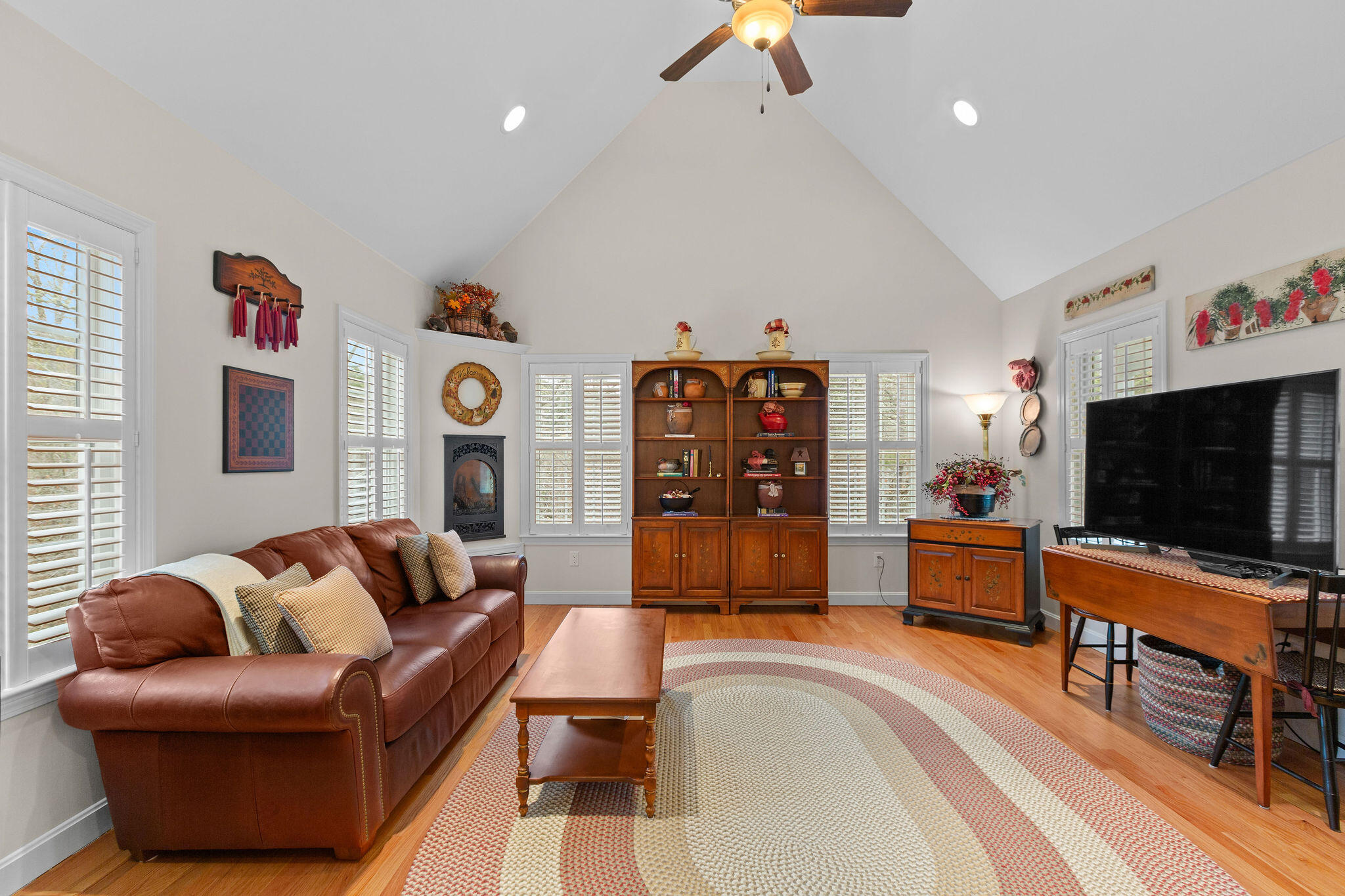 154 Beechtree Drive Brewster, MA 02631 - Photo 43 of 76 a living room with furniture and a flat screen tv