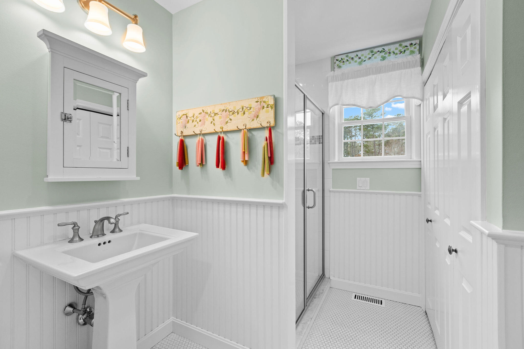 154 Beechtree Drive Brewster, MA 02631 - Photo 47 of 76 a bathroom with a sink a mirror and a shower