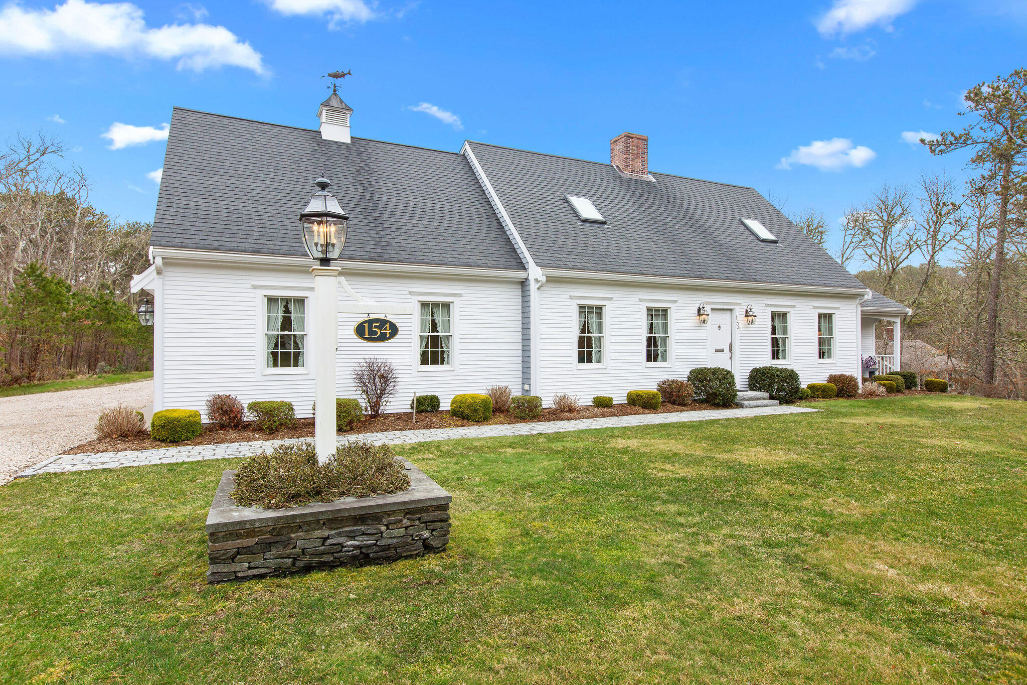 154 Beechtree Drive Brewster, MA 02631 - Photo 5 of 76 a front view of a house with a yard