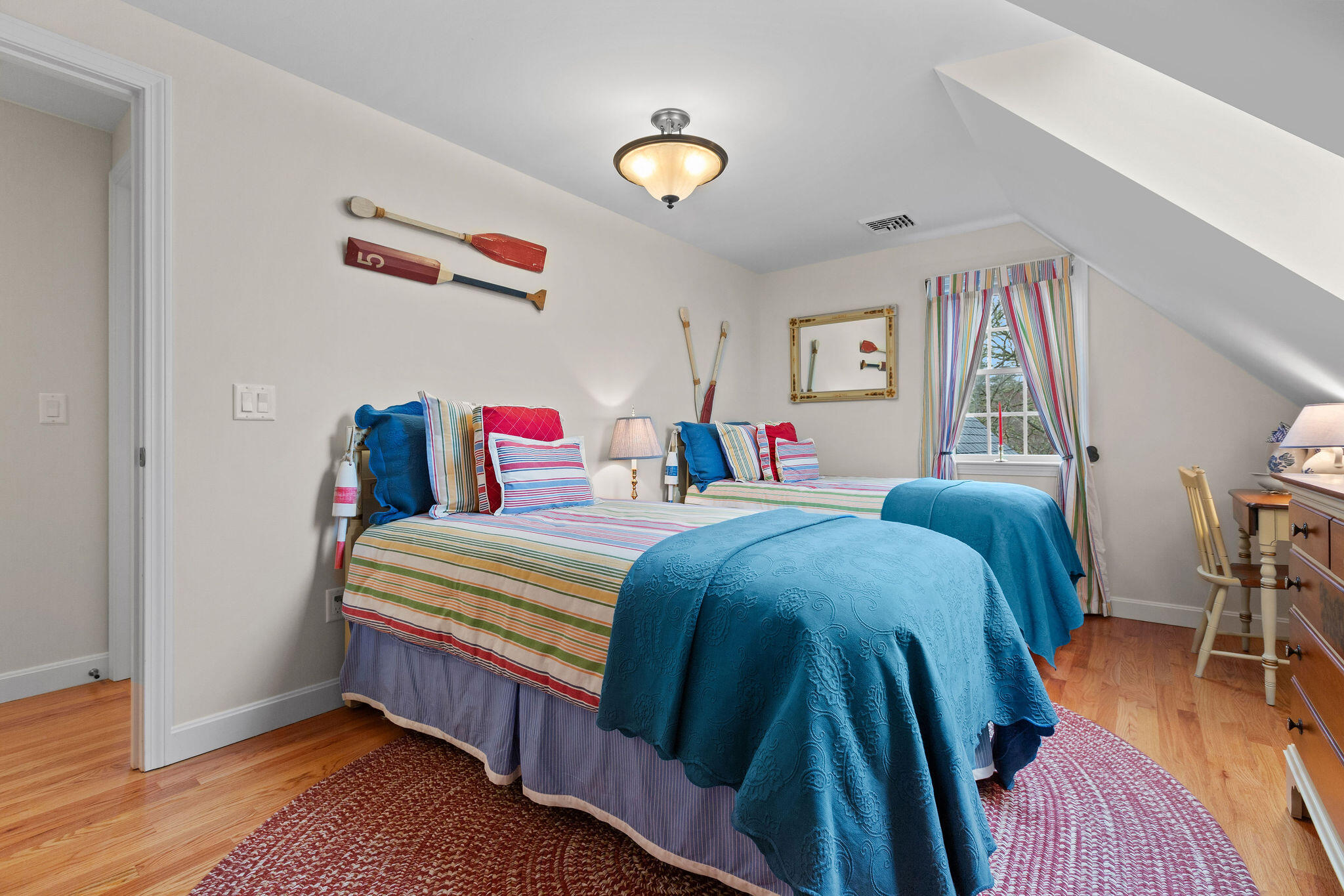 154 Beechtree Drive Brewster, MA 02631 - Photo 52 of 76 a bedroom with a bed and wooden floor