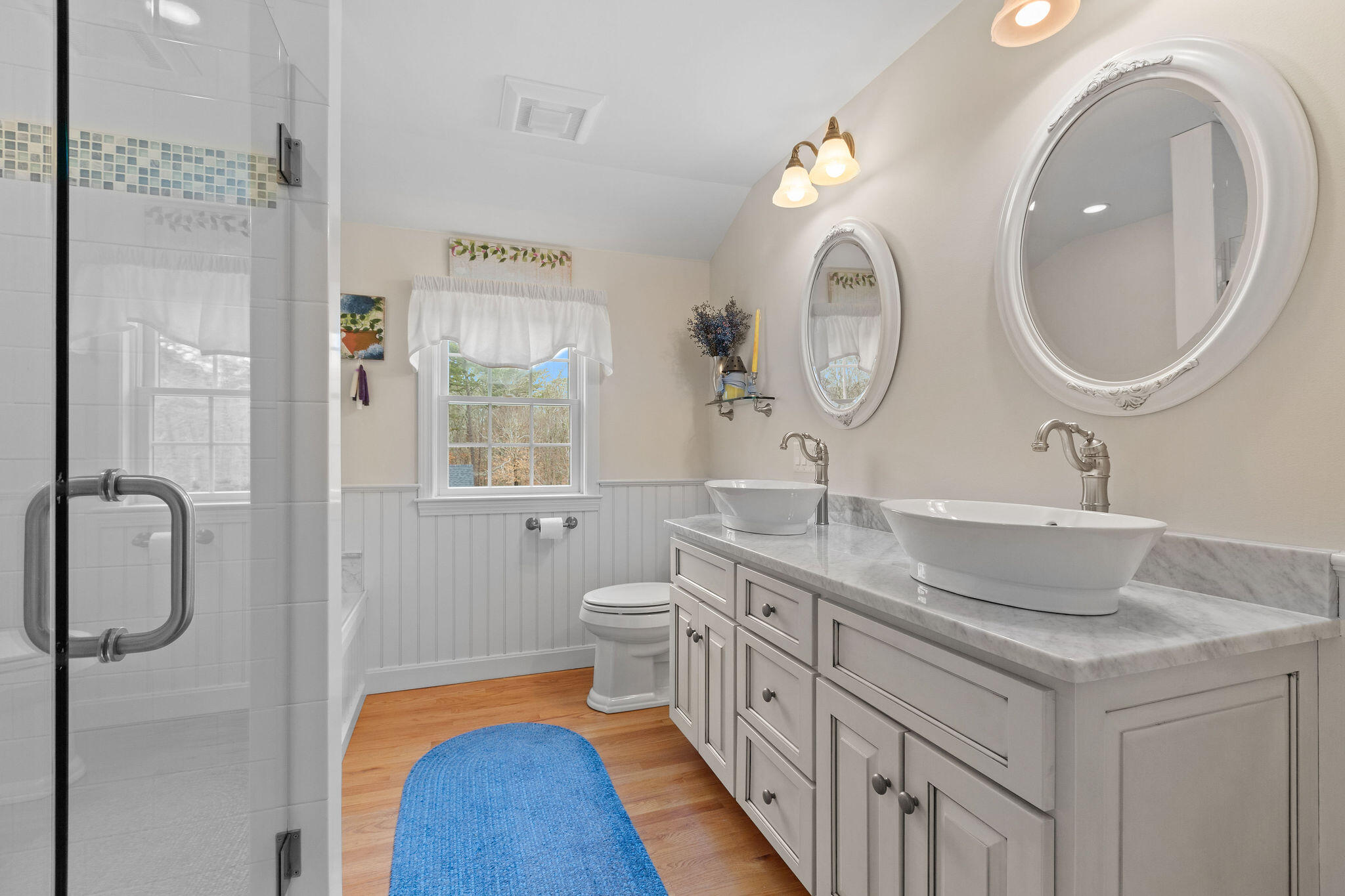154 Beechtree Drive Brewster, MA 02631 - Photo 65 of 76 a bathroom with a double vanity sink and a mirror