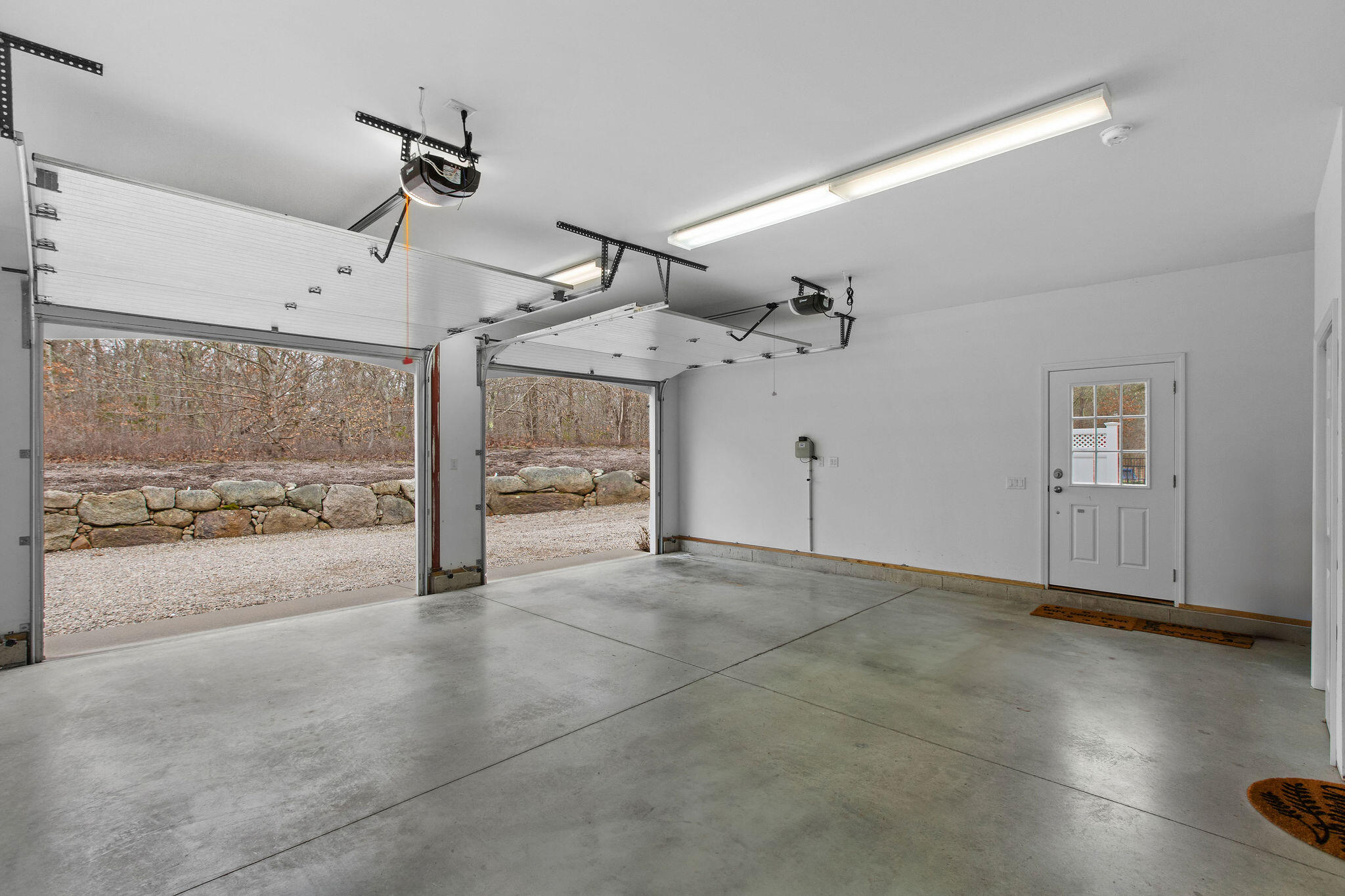 154 Beechtree Drive Brewster, MA 02631 - Photo 70 of 76 a view of a livingroom with wooden floor and a ceiling fan