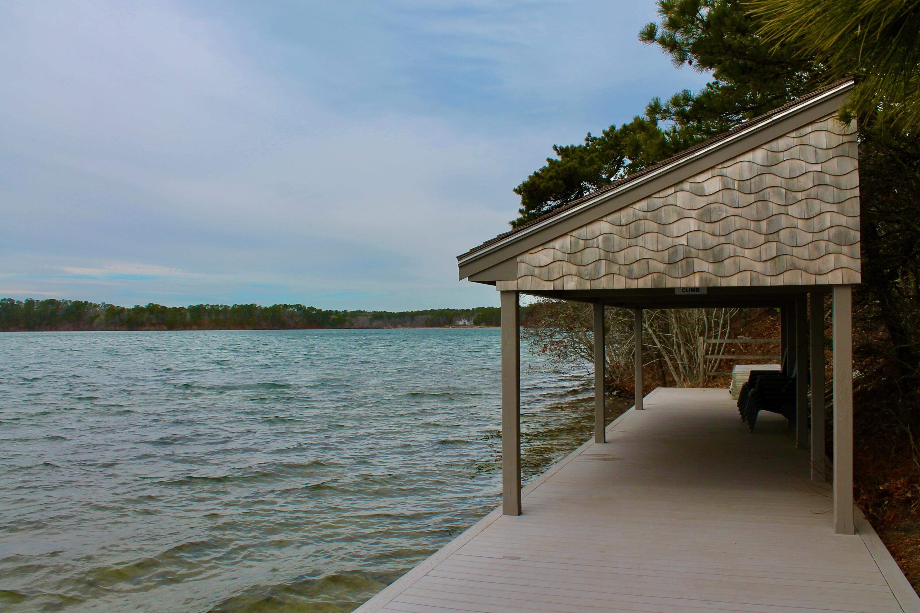 154 Beechtree Drive Brewster, MA 02631 - Photo 72 of 76 a terrace with outdoor seating and lake view