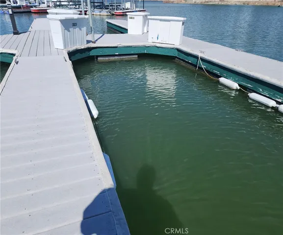 a small white building with a white water fall