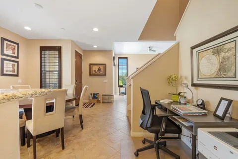 a workspace with furniture and window
