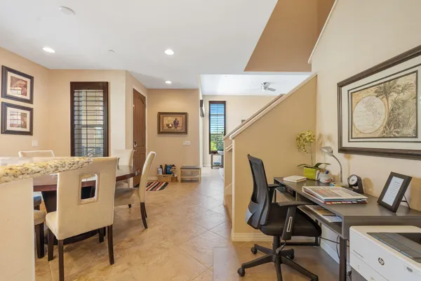 a workspace with furniture and window