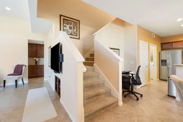 a view of a livingroom with furniture and a flat screen tv