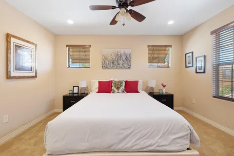 a bedroom with a large bed and a window