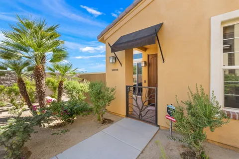 a couple of potted plants in front of door