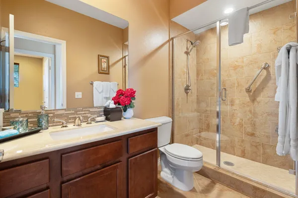 a bathroom with a shower and toilet