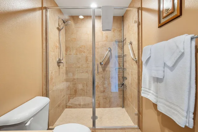 a view of washer and dryer with kitchen in the background