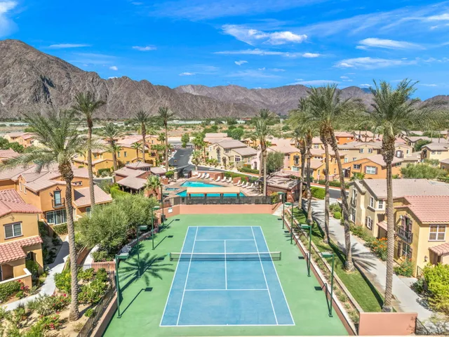 an aerial view of residential house and sandy dunes