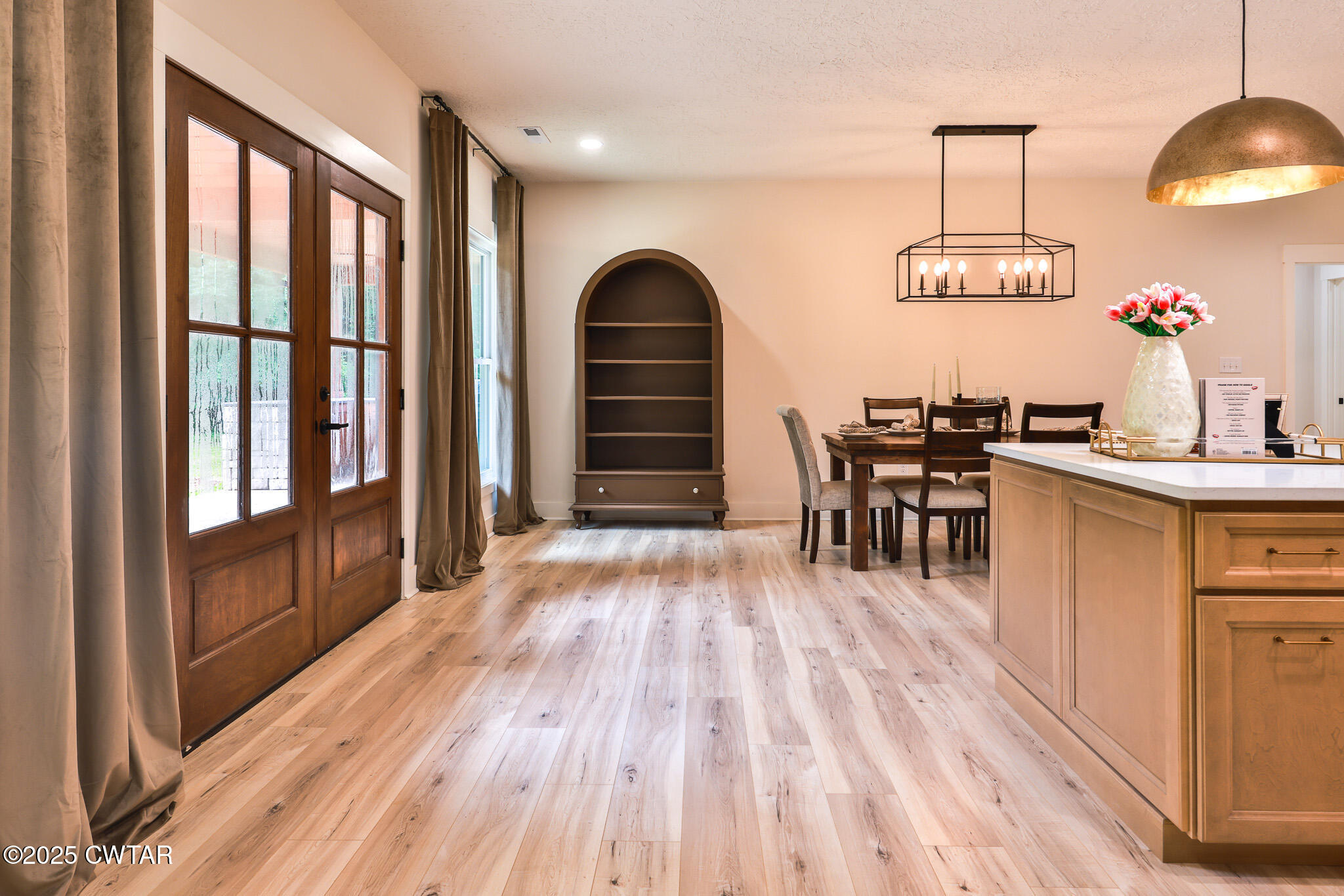 201 Trevathan Road Martin, TN 38237 - Photo 29 of 50 a dining room with furniture a chandelier and wooden floor