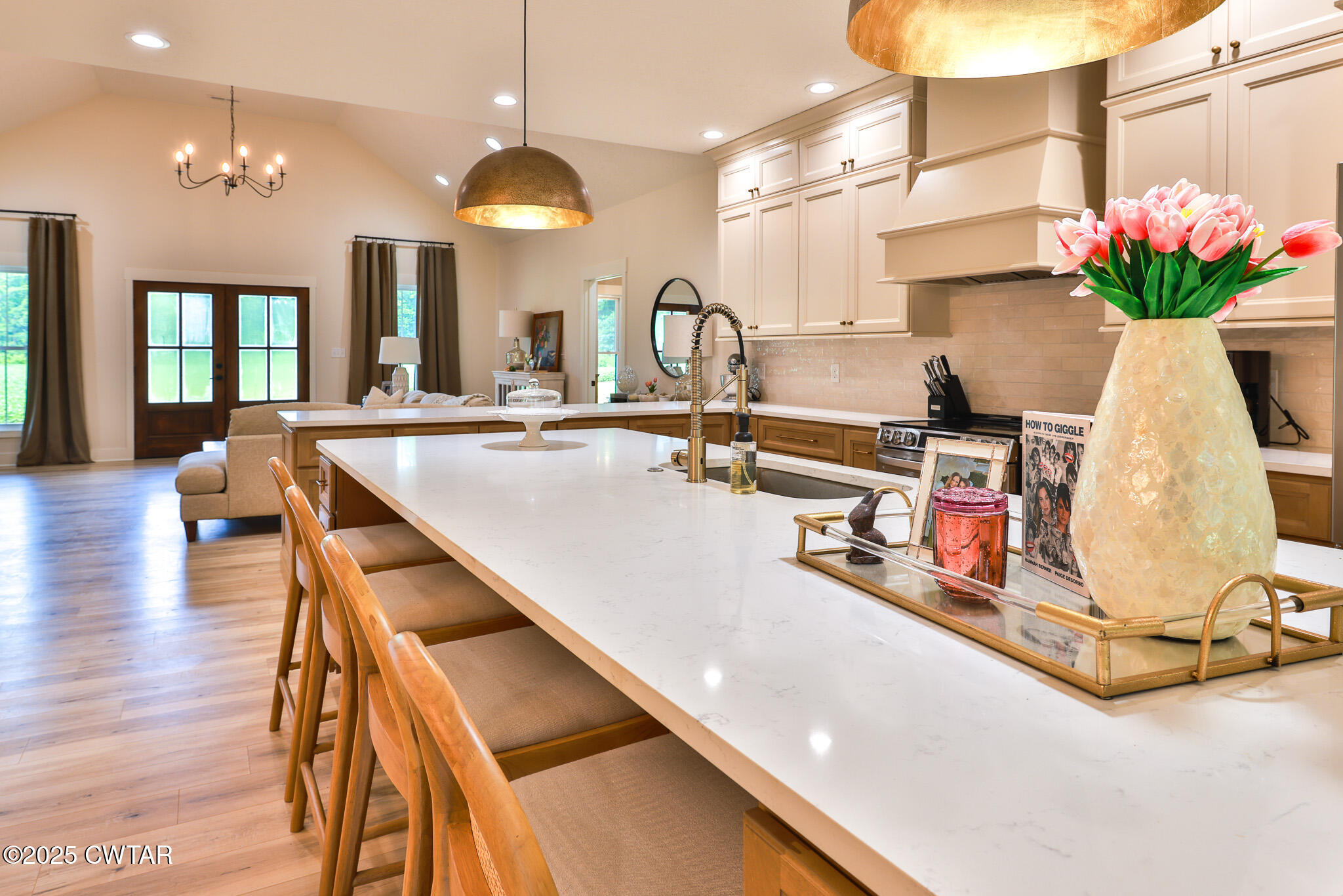 201 Trevathan Road Martin, TN 38237 - Photo 32 of 50 a kitchen with stainless steel appliances kitchen island granite countertop a sink dishwasher and a dining table with wooden floor