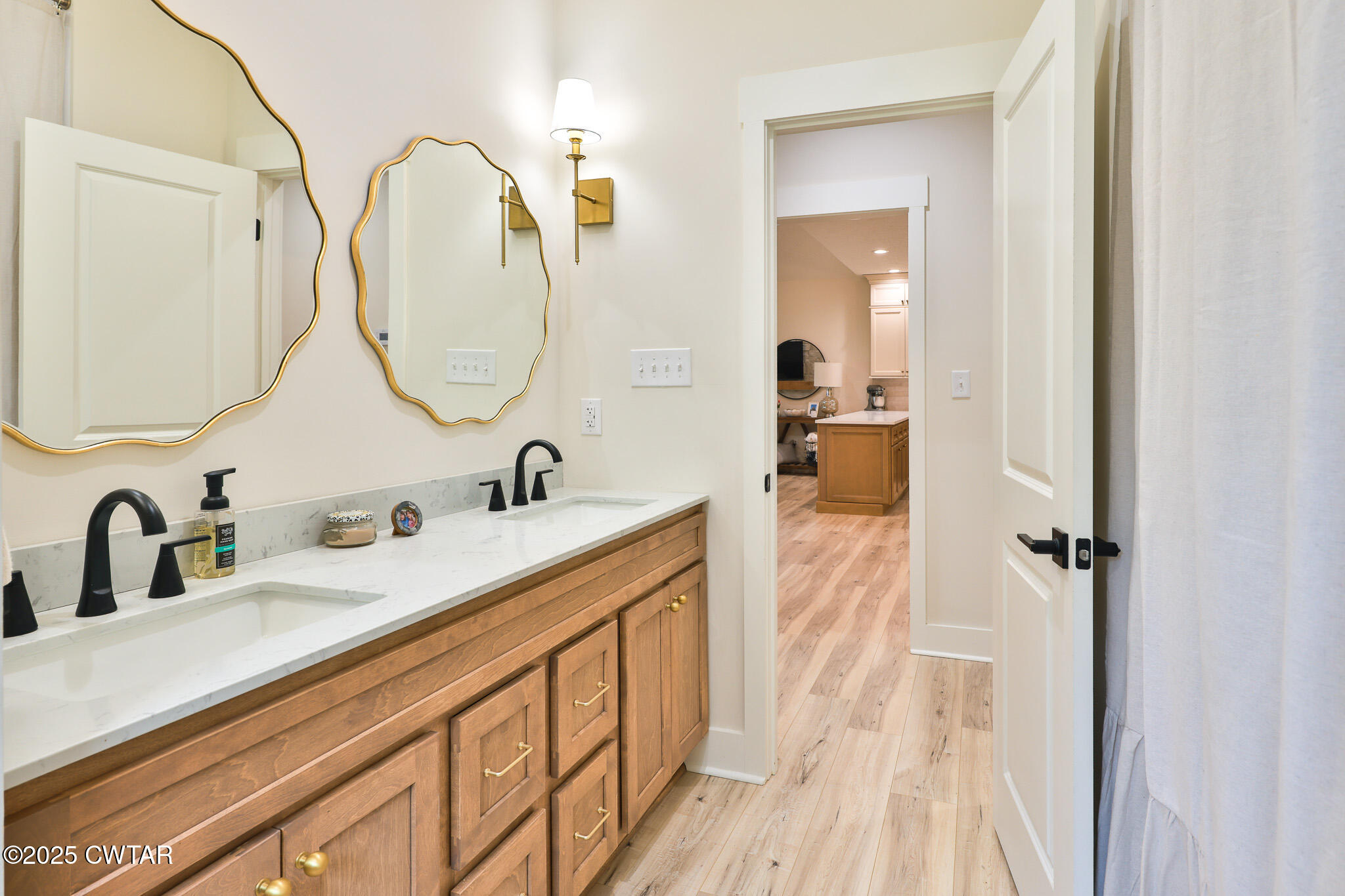 201 Trevathan Road Martin, TN 38237 - Photo 48 of 50 a en suite bathroom with a double vanity sink and a mirror