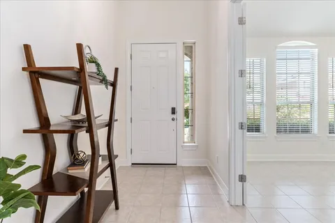 a view of an entryway with wooden floor