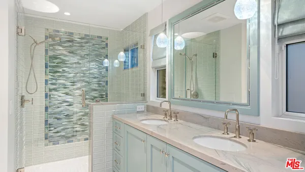 a view of a balcony with chair and wooden floor