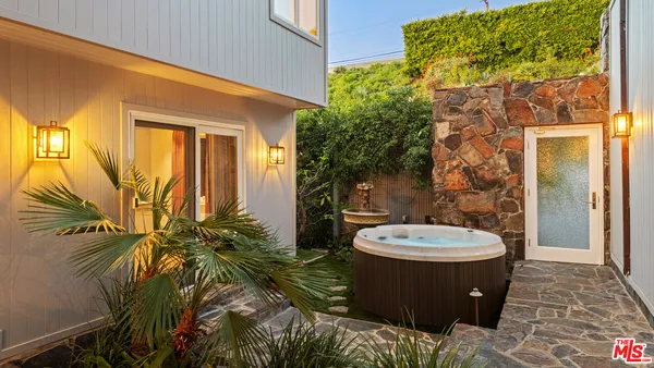 a view of a bathroom with a toilet and a shower