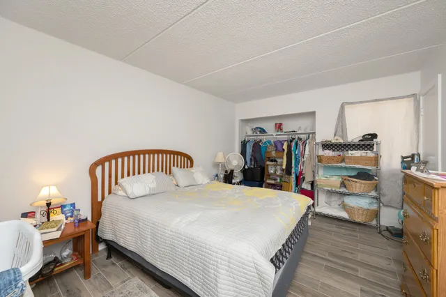 a bed room with a bed and a mirror