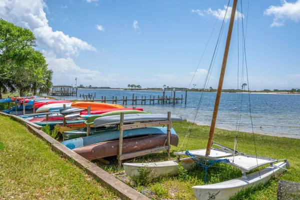 a view of a swimming pool with a yard