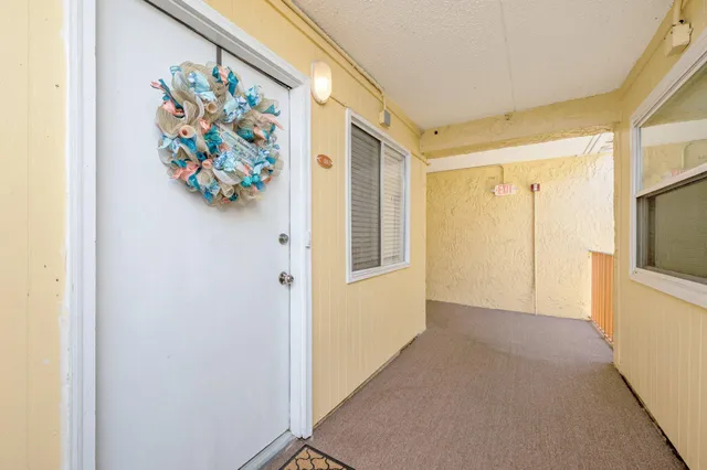 a view of an entryway with painting on the wall