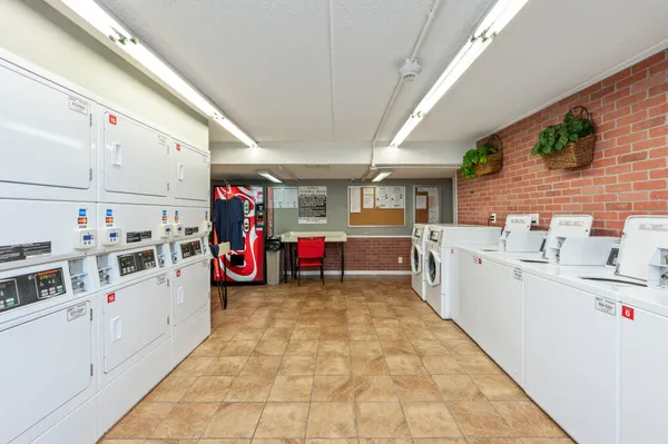 a kitchen with stainless steel appliances refrigerator sink and microwave