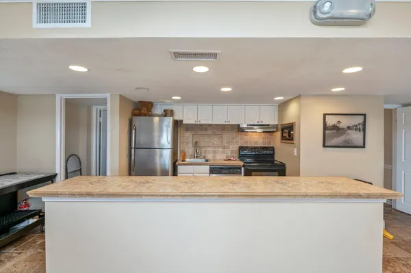 an aerial view of a houses with ocean view