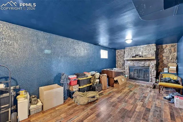 a bedroom with furniture and a fireplace