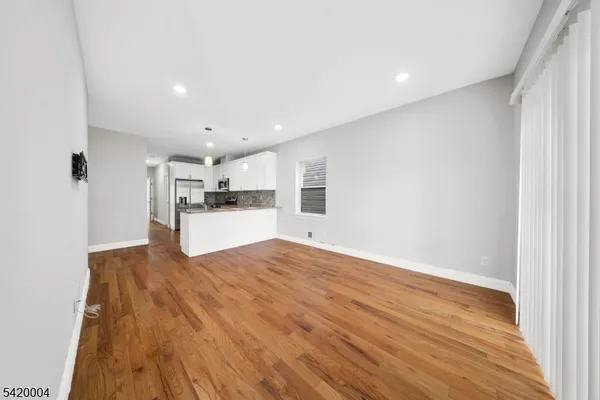 a view of kitchen and wooden floor