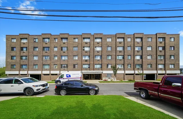 a car parked in front of a house with a yard