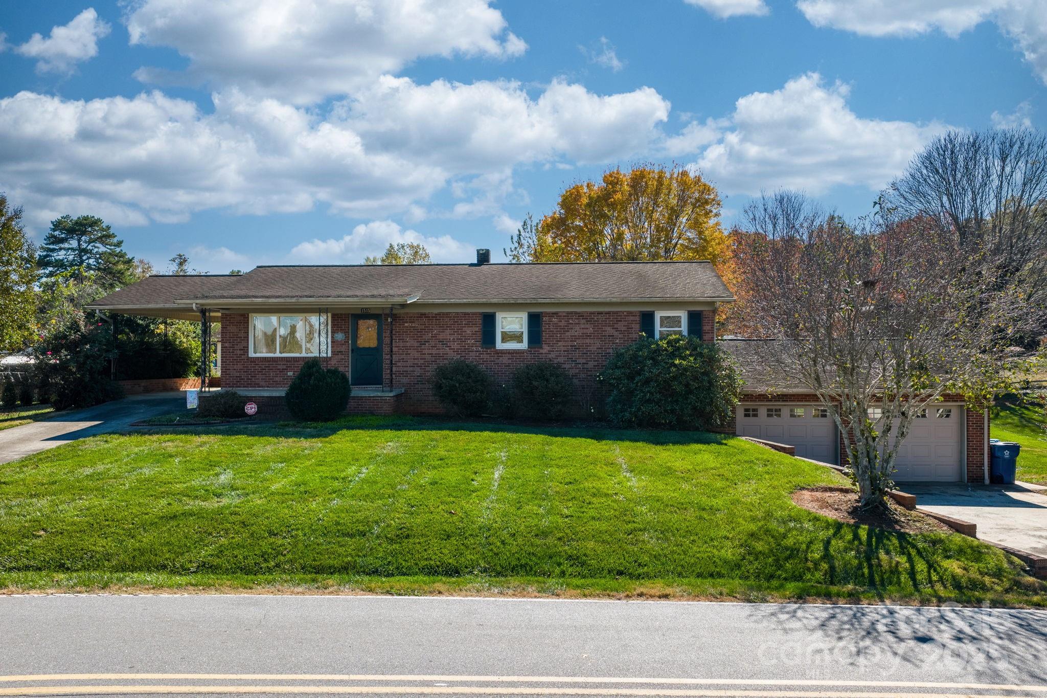 1515 Fairway Acres Road Lenoir, NC 28645 - Photo 1 of 35 a view of a house with a yard