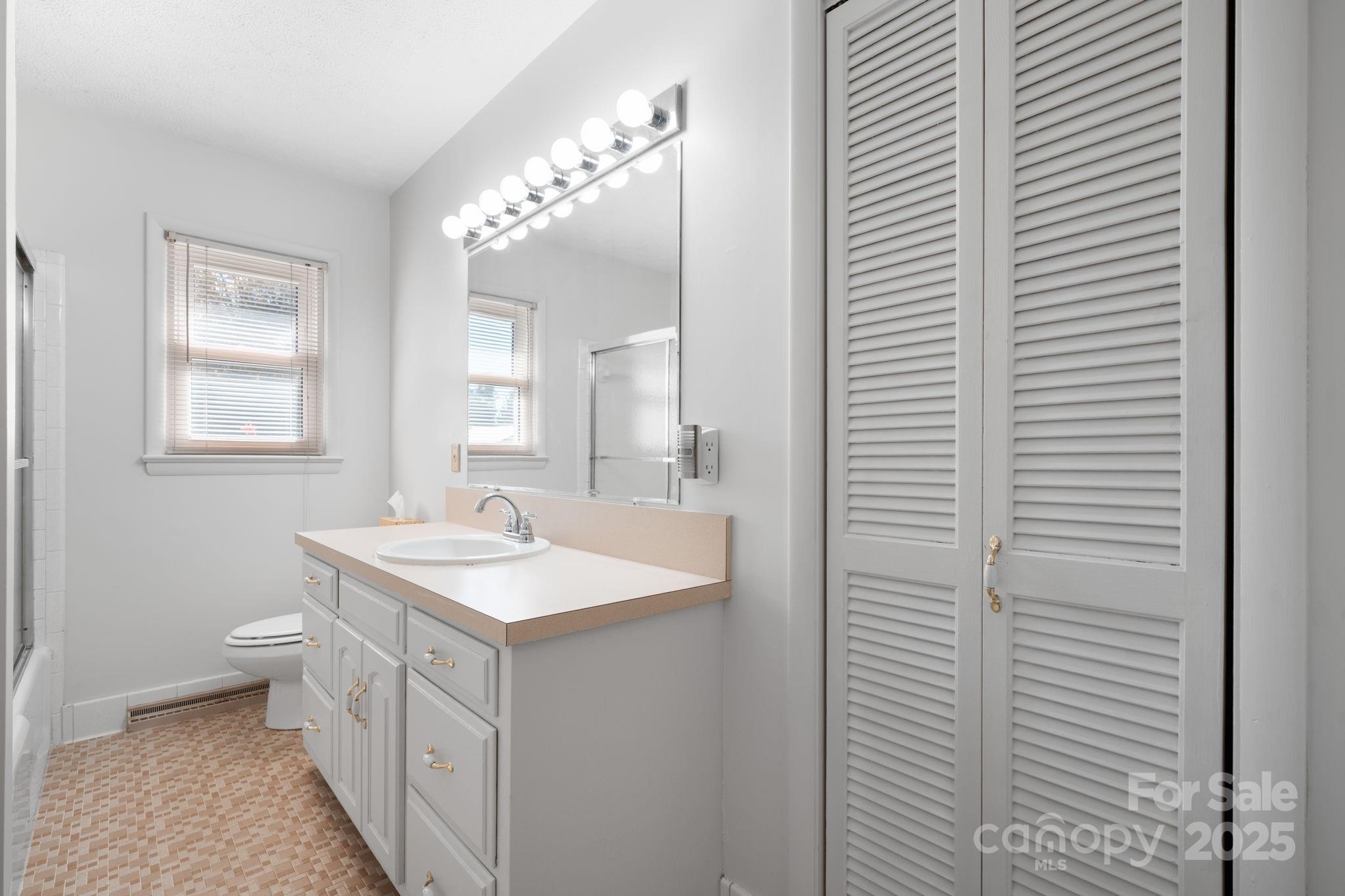1515 Fairway Acres Road Lenoir, NC 28645 - Photo 11 of 35 a bathroom with a sink and a mirror