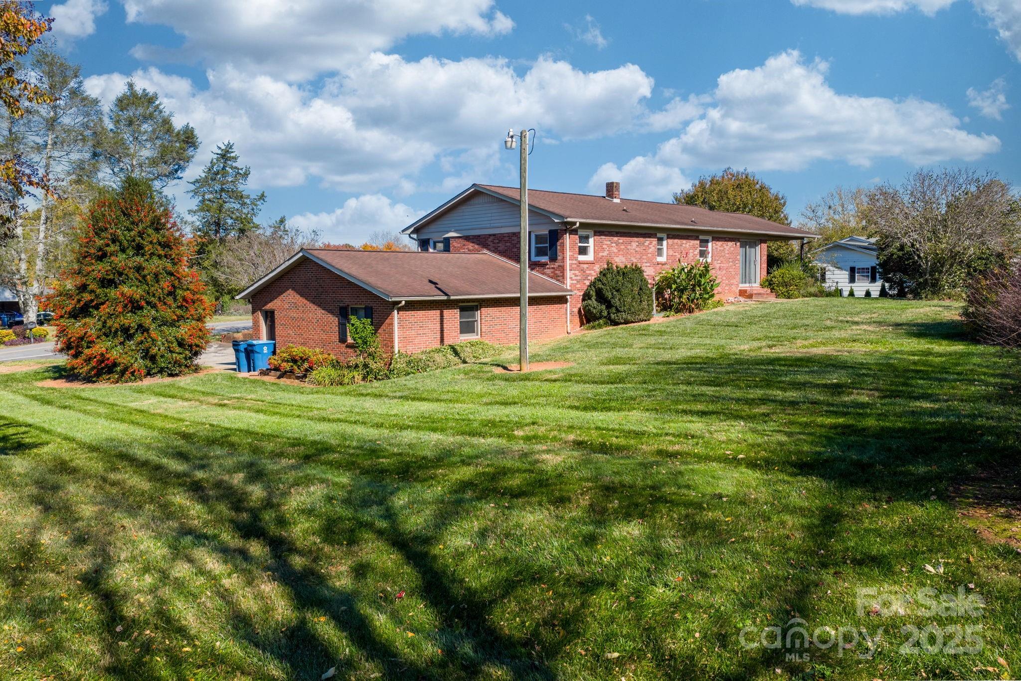 1515 Fairway Acres Road Lenoir, NC 28645 - Photo 22 of 35 a front view of a house with garden