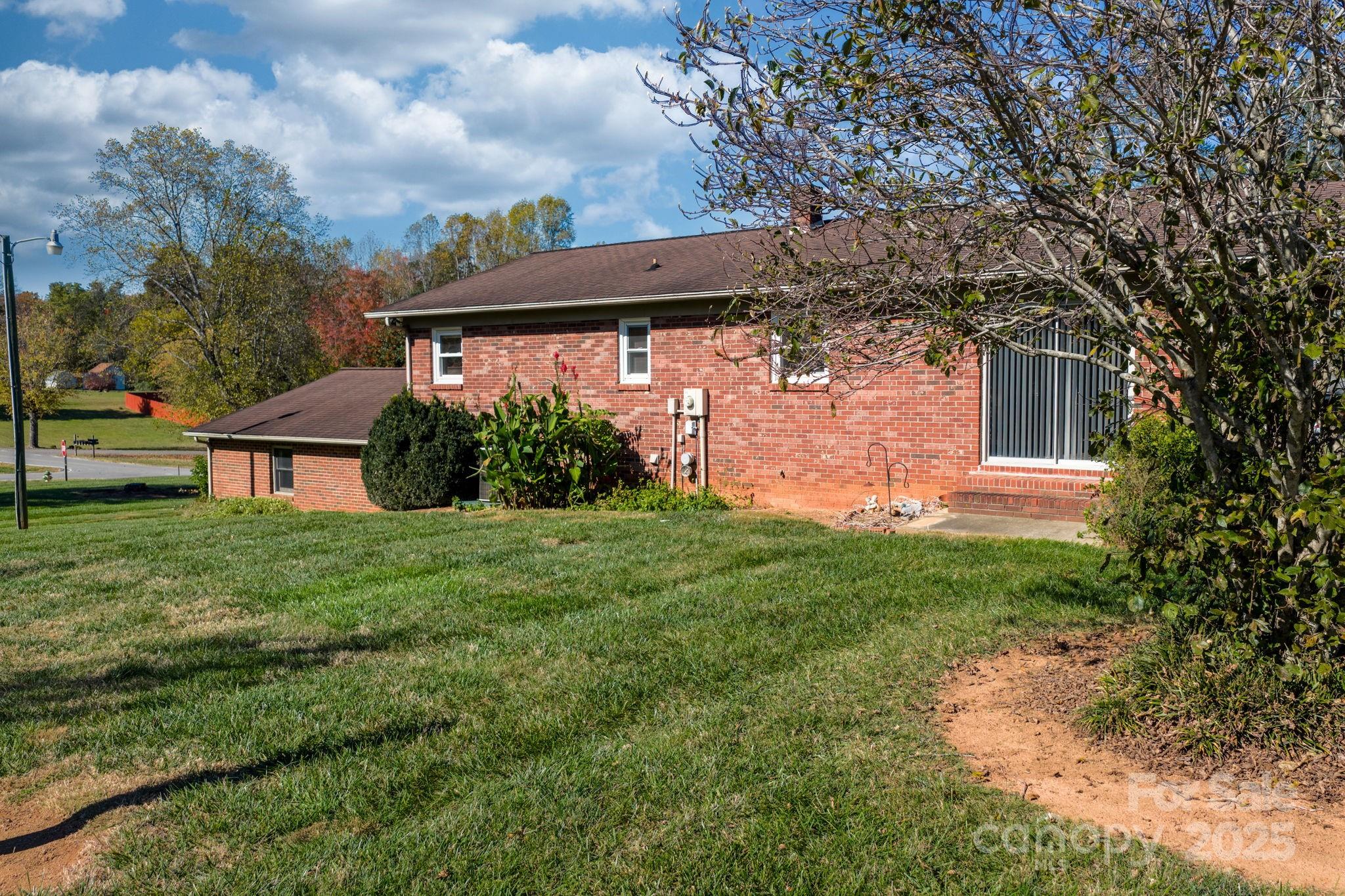 1515 Fairway Acres Road Lenoir, NC 28645 - Photo 32 of 35 a view of a house with a backyard