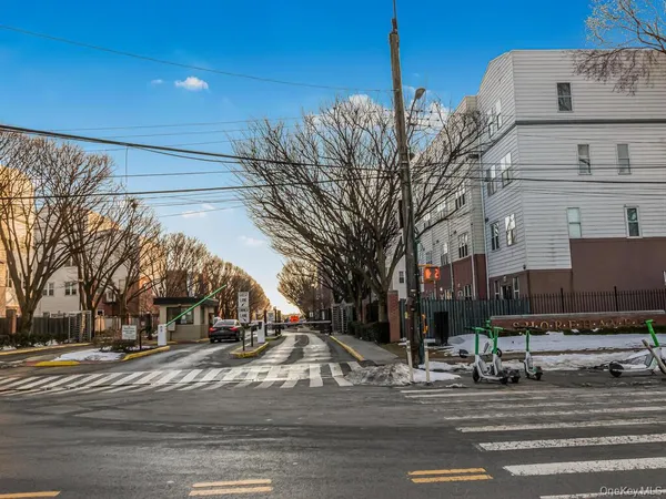 a view of a city street with a building
