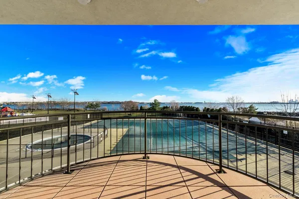 a dining room with furniture a flat screen tv and a painting