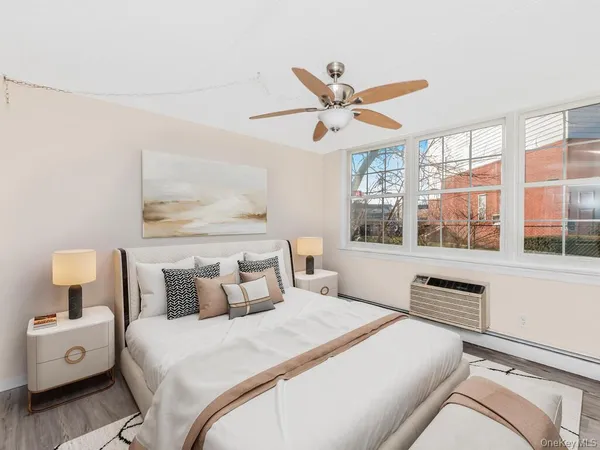 a bedroom with a large bed and a window