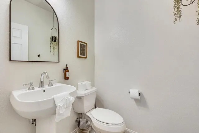 a bedroom with a bed and a ceiling fan