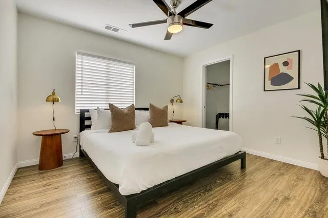 a bathroom with a sink double vanity and a toilet