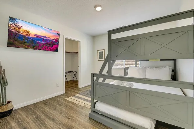 a bed room with a bed and a window