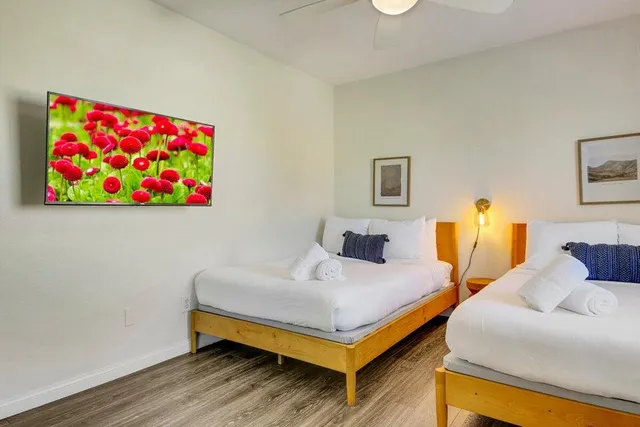 a view of a patio with couches table and chairs and potted plants