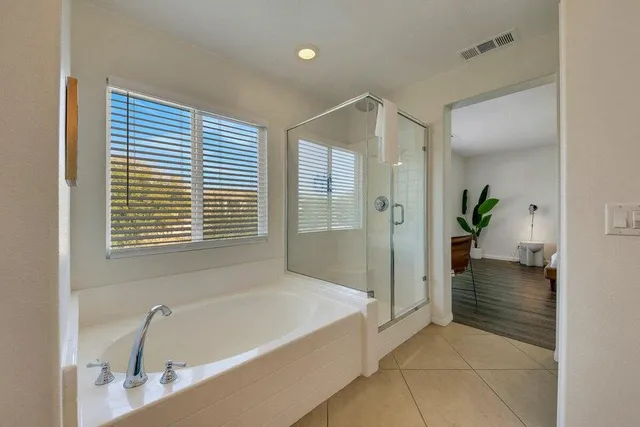 a view of a patio with a table chairs and a backyard